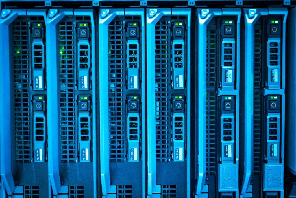 Evaluate The Technology Hardware Company HP on Dell Server Reliability Detailed image of illuminated server racks showcasing modern technology infrastructure.